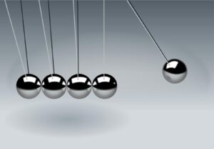 Dynamic illustration of Newton's Cradle showing motion and reflection concepts in physics.