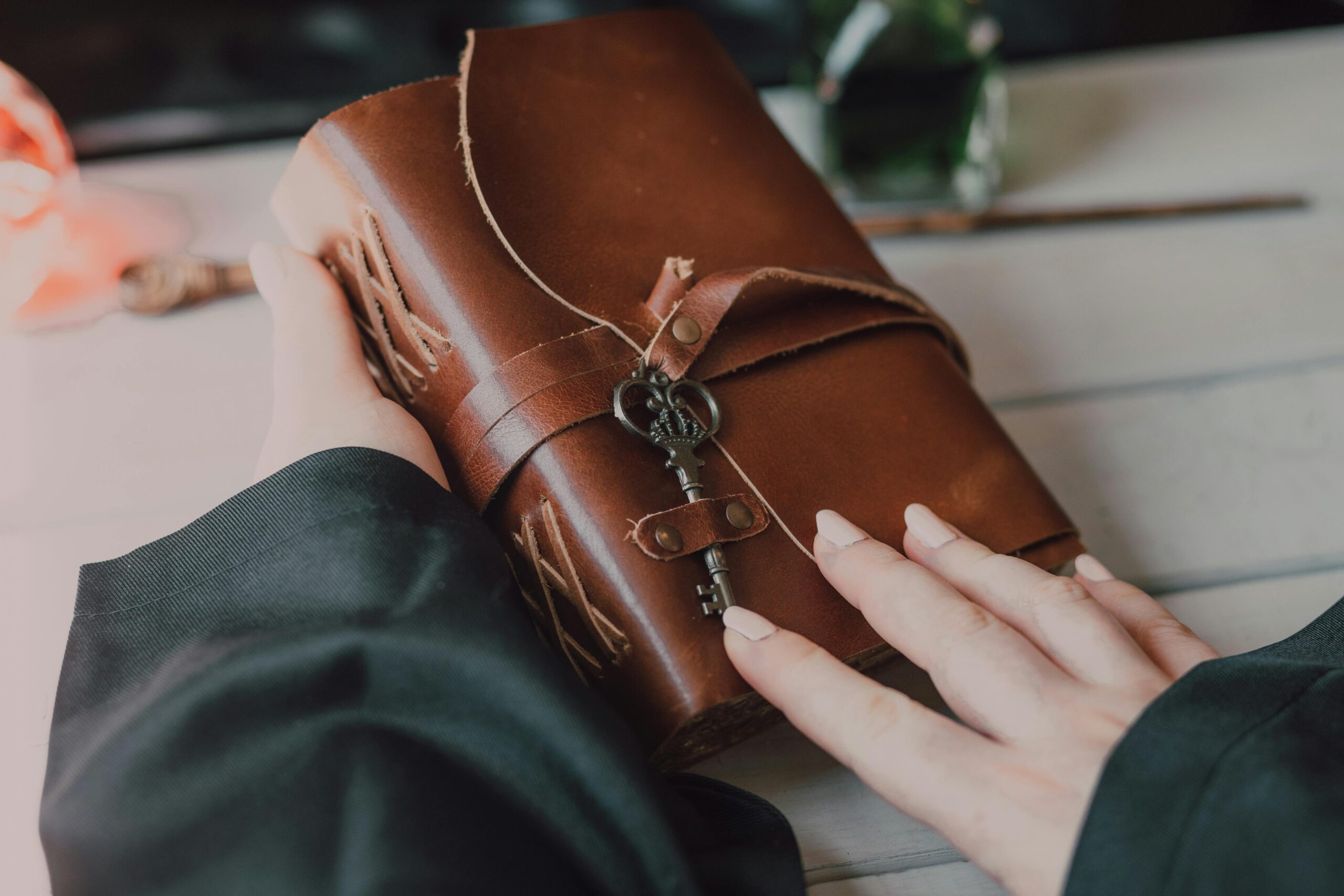 Close up shot of a person holding a spell book